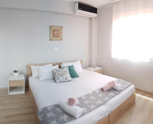 Ένα ή περισσότερα κρεβάτια σε δωμάτιο στο Anesis Seaview Apartment 2