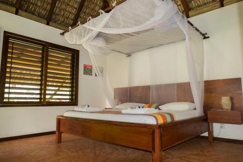 מיטה או מיטות בחדר ב-Cabañas Amaia