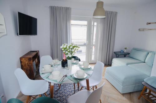 Posedenie v ubytovaní Apartamenty Piaskowe B21 z tarasem na dachu