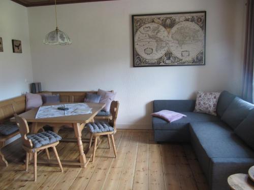 a living room with a couch and a table at Landhaus Obervellach in Hermagor