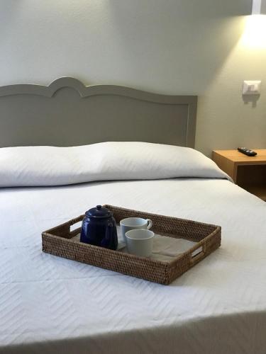 En eller flere senge i et værelse på Cinema House Apartments