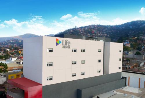a building with a life hotel sign on top of it at Life Hotel in Oaxaca City