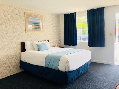 Ένα ή περισσότερα κρεβάτια σε δωμάτιο στο GuestLodge