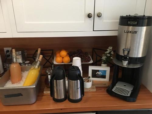 a kitchen counter with a coffee maker and a mixer at The Waterford Inn in Provincetown