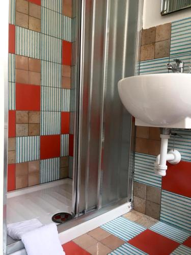 a bathroom with a sink and a shower at La Dimora del Cont'Orto in Giulianova