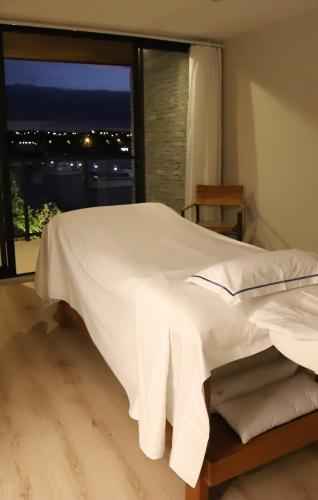 Postel nebo postele na pokoji v ubytování Hotel Aretê