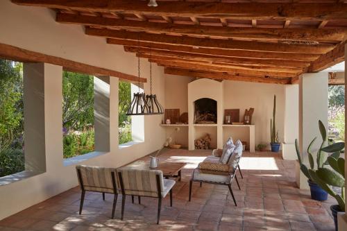 a living room with a table and chairs at Finca Santana in Cachí