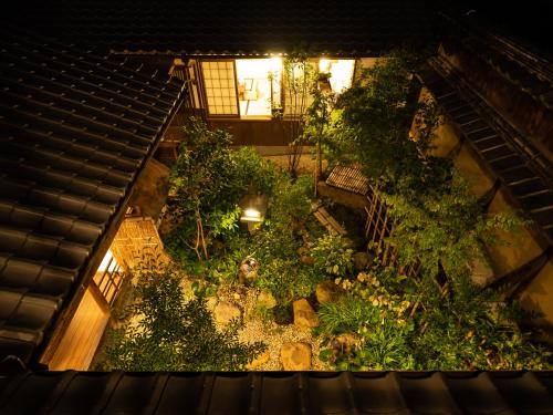 an overhead view of a garden in a building at Inase Otsu Machiya Bed and Breakfast in Otsu