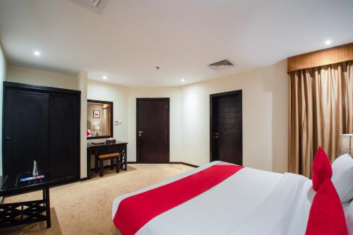 Кровать или кровати в номере ITLALA ALSHARQ FOR SERVICED APARTMENTs
