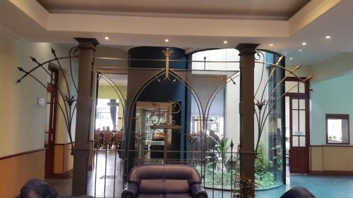 a room with a glass room with a baptismificialificialificialificialificialificialificial at Hotel Plaza Rafaela in Rafaela