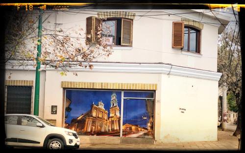 a building with a large painting on the side of it at La San Francisco II in Salta