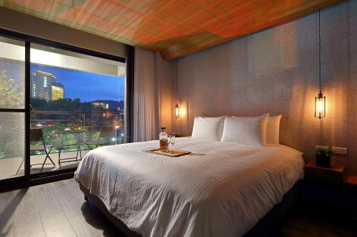 Ein Bett oder Betten in einem Zimmer der Unterkunft Sun Moon Lake Blue Sky Bay B&B