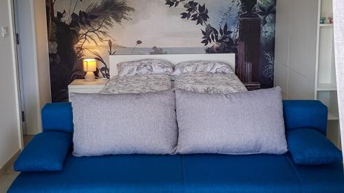 a bed with two pillows on top of it at CUBE apartments in Vir