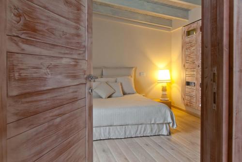 Säng eller sängar i ett rum på Palazzo Arco Cadura & Spa