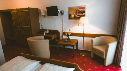 Cama o camas de una habitación en Hotel Büchner Garni