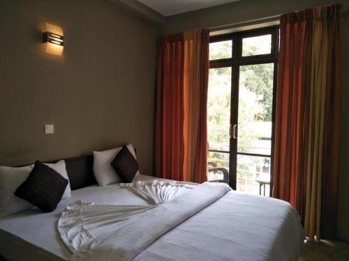 Postel nebo postele na pokoji v ubytování Hikers Lodge Ella