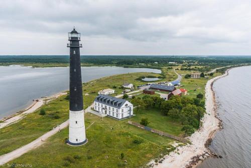 an aerial view of a lighthouse on an island at Cozy Summer House with Free Parking near City Center & Beach in Kuressaare