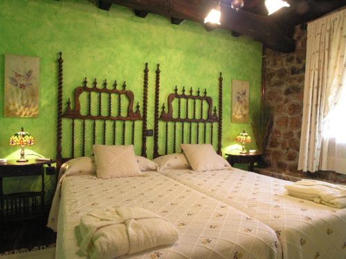 Tempat tidur dalam kamar di Posada Trisileja
