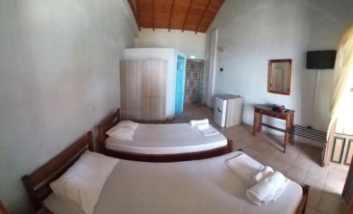 Ein Bett oder Betten in einem Zimmer der Unterkunft Maniatiko Rooms