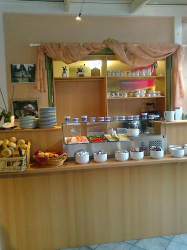 a buffet line with fruits and vegetables on a counter at Hotel Gasthof Turm in Grünhaid