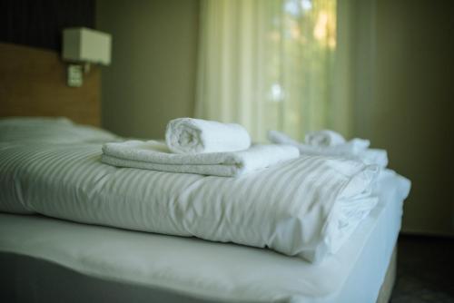 Postel nebo postele na pokoji v ubytování Easy Suites Hévíz
