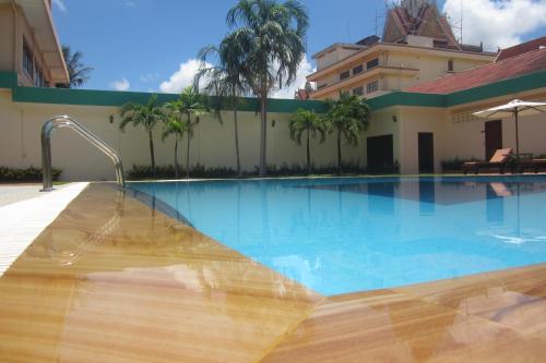 a swimming pool in front of a building at City Angkor Hotel in Siem Reap