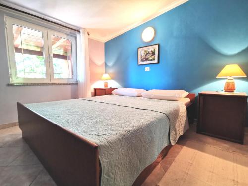 Кровать или кровати в номере Apartments Villa Amaryllis