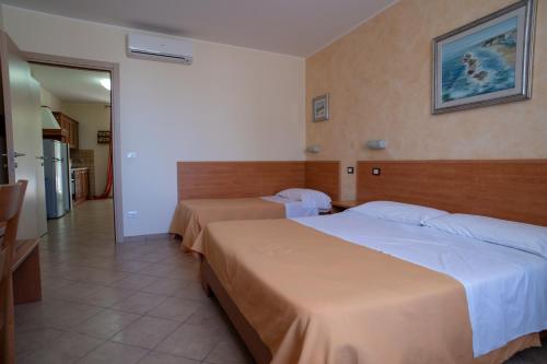 Llit o llits en una habitació de B&B Il Giardino di Zefiro