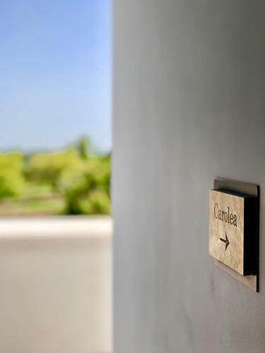 a close up of a light switch on a door at Oikos in Terre di Zaccanello in Racalmuto