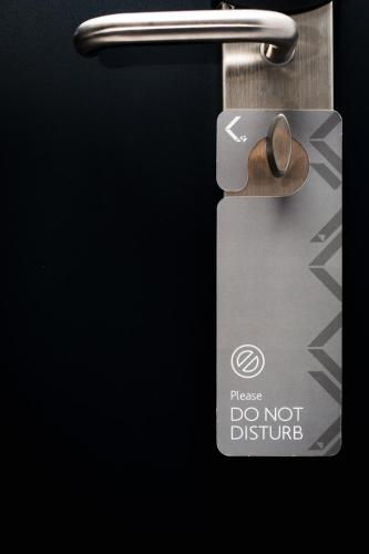 a door latch with a do not disturb sign on it at Crystal villas & suites in Polykhrono