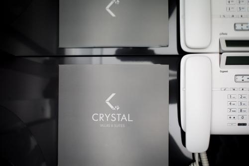 a box sitting next to a computer and a keyboard at Crystal villas & suites in Polykhrono