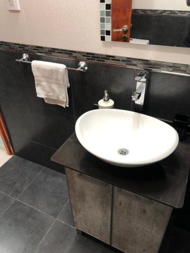a bathroom with a white sink on a counter at Santa Rita in San Rafael