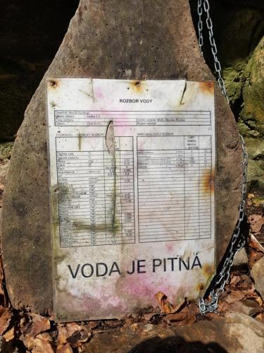 a sign on a rock on a chain at Slovak cottage near Bratislava in the heart of the Carpathians in Modra