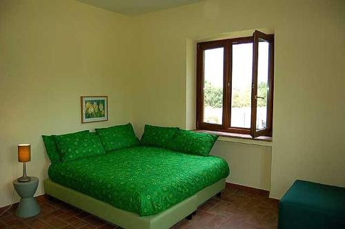 Giường trong phòng chung tại Casavacanze Sant'Eugenia