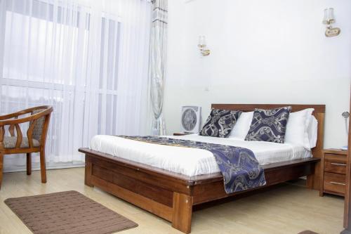 Ένα ή περισσότερα κρεβάτια σε δωμάτιο στο Hôtel Sky blue Mada
