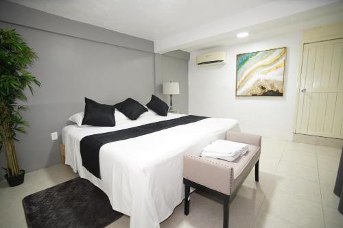 Postel nebo postele na pokoji v ubytování Downtown Hostel Chetumal