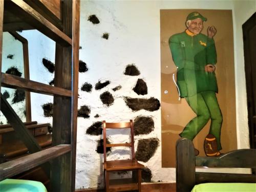 a mural of a soldier on the wall of a room at I MITI ViviendaVacacional in Chio