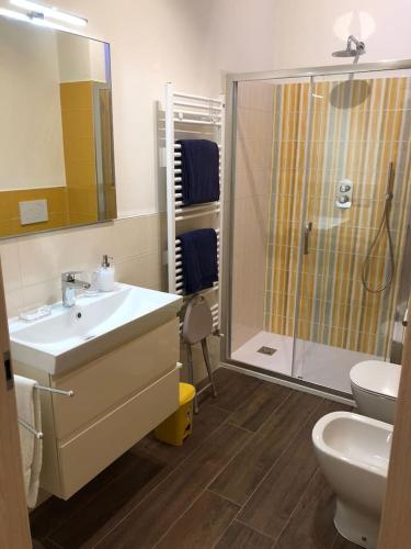 a bathroom with a shower and a sink and a toilet at Daniele Guest Apartment in Pistoia
