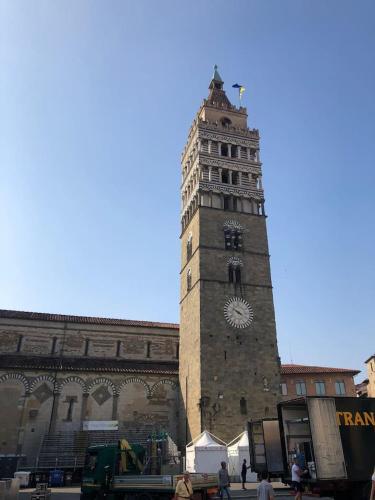 a tall clock tower in front of a building at Daniele Guest Apartment in Pistoia