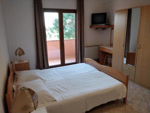 Postel nebo postele na pokoji v ubytování Guest House Caterina