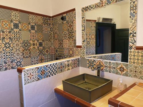 a bathroom with a sink and a mirror at Casa Rural El Chacho - Velefique in Velefique