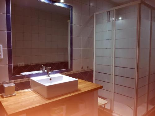 a bathroom with a sink and a mirror at Lina Mogan in Puerto de Mogán