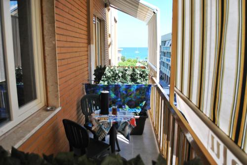 a balcony with a table and chairs on a balcony at B&b Cefalù in Cefalù
