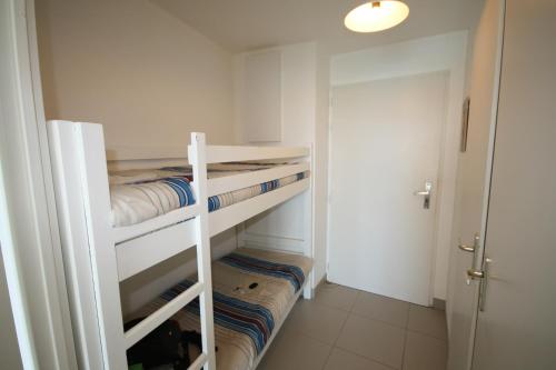 En eller flere senge i et værelse på Résidence la Voile Blanche 4