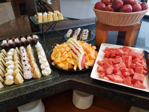 a buffet of different types of food on a counter at Gai Beach Hotel in Tiberias