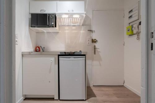 Virtuvė arba virtuvėlė apgyvendinimo įstaigoje Appartement 1 - tout équipé et fonctionnel - Carmes, Toulouse