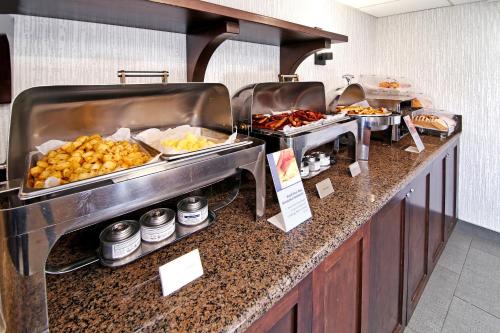 a buffet line with many different types of food at Best Western Plus Banff International Lodge in Banff