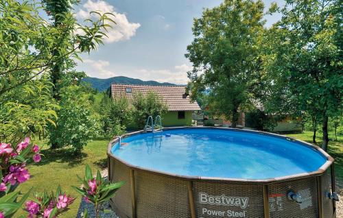 a large swimming pool in the yard of a house at Kuća za odmor Pri Brozu in Kumrovec