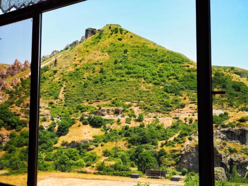 a view of a mountain from a window at Kirch Hotel & Restaurant in Goris