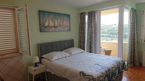 Posteľ alebo postele v izbe v ubytovaní Seaside apartment